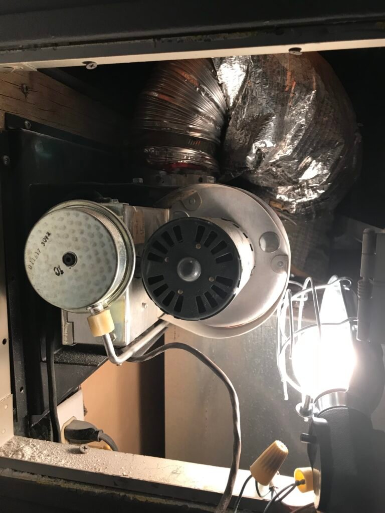 Licensed technician testing a gas fireplace blower electrical circuit