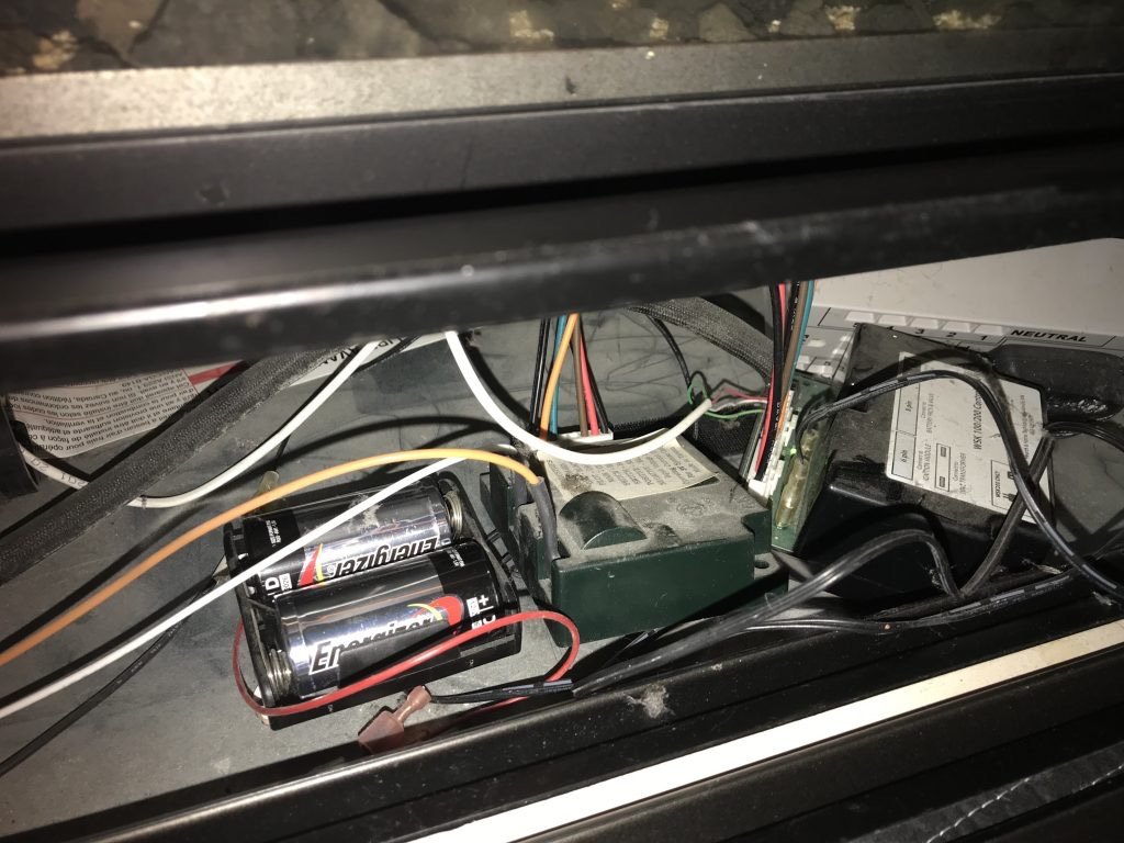 Checking batteries in a gas fireplace remote and receiver